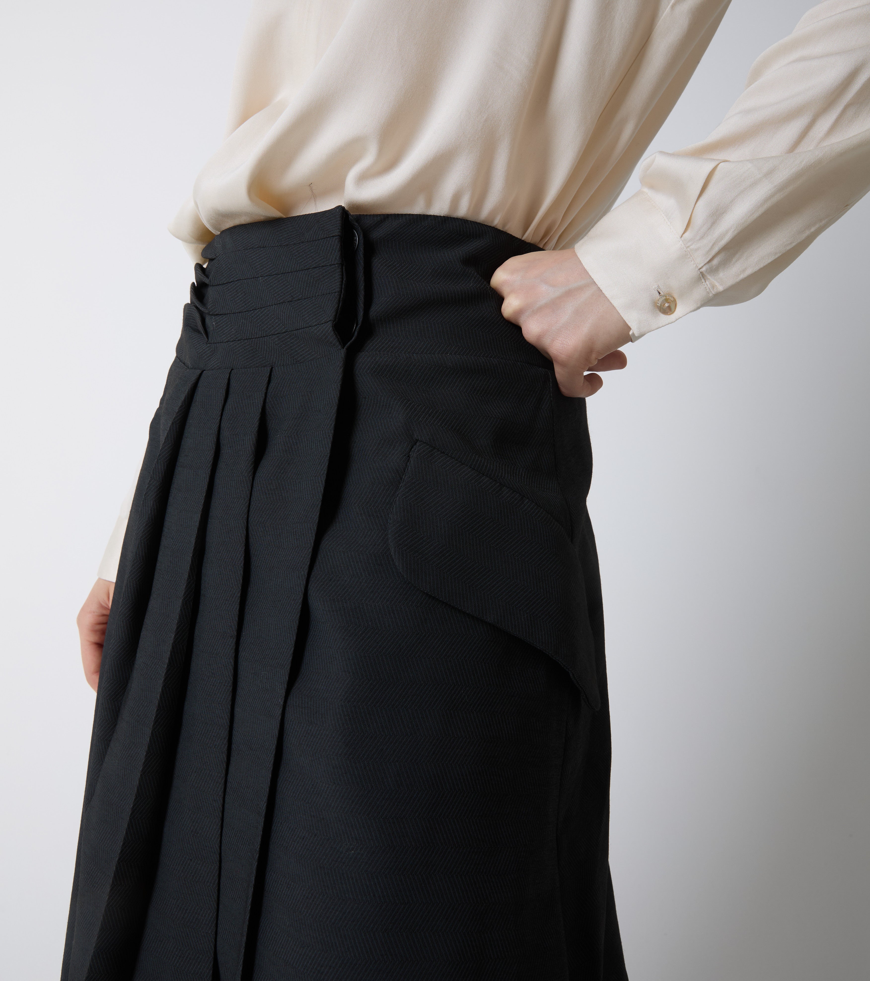 Long asymmetrical skirt with pleats