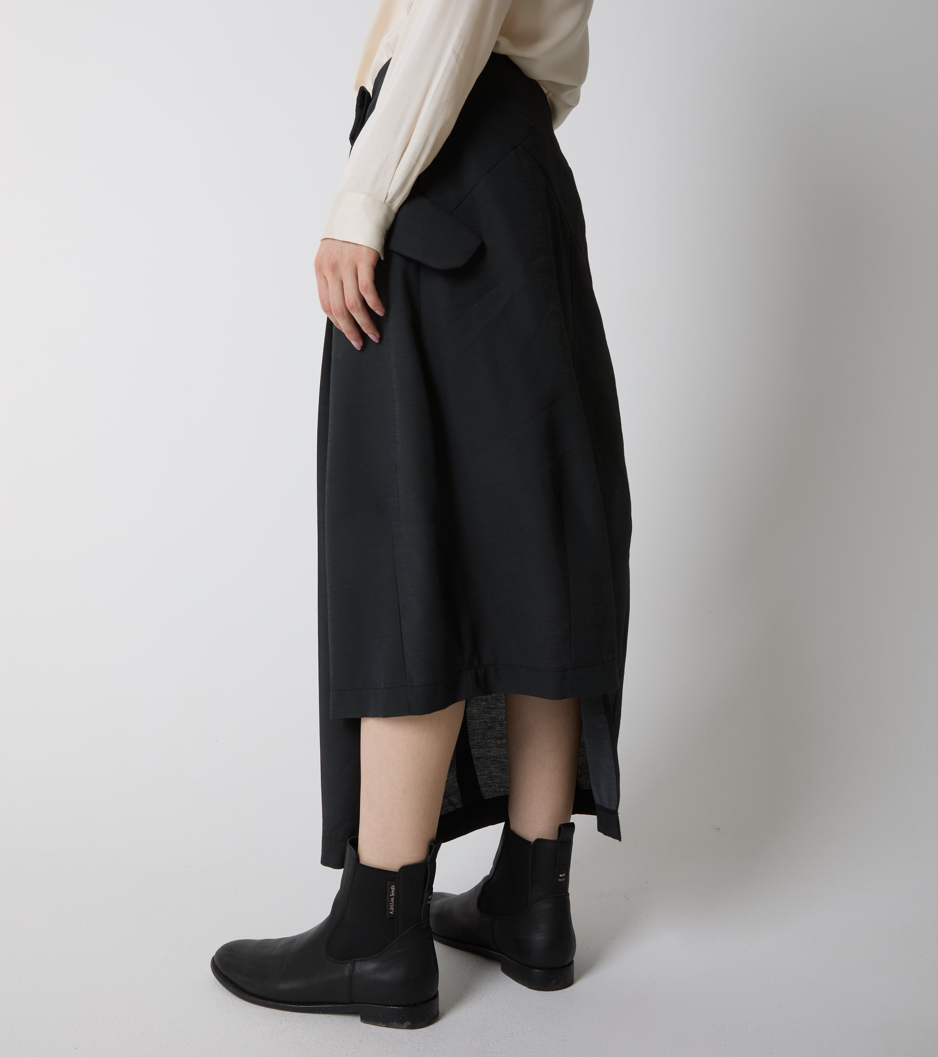Long asymmetrical skirt with pleats