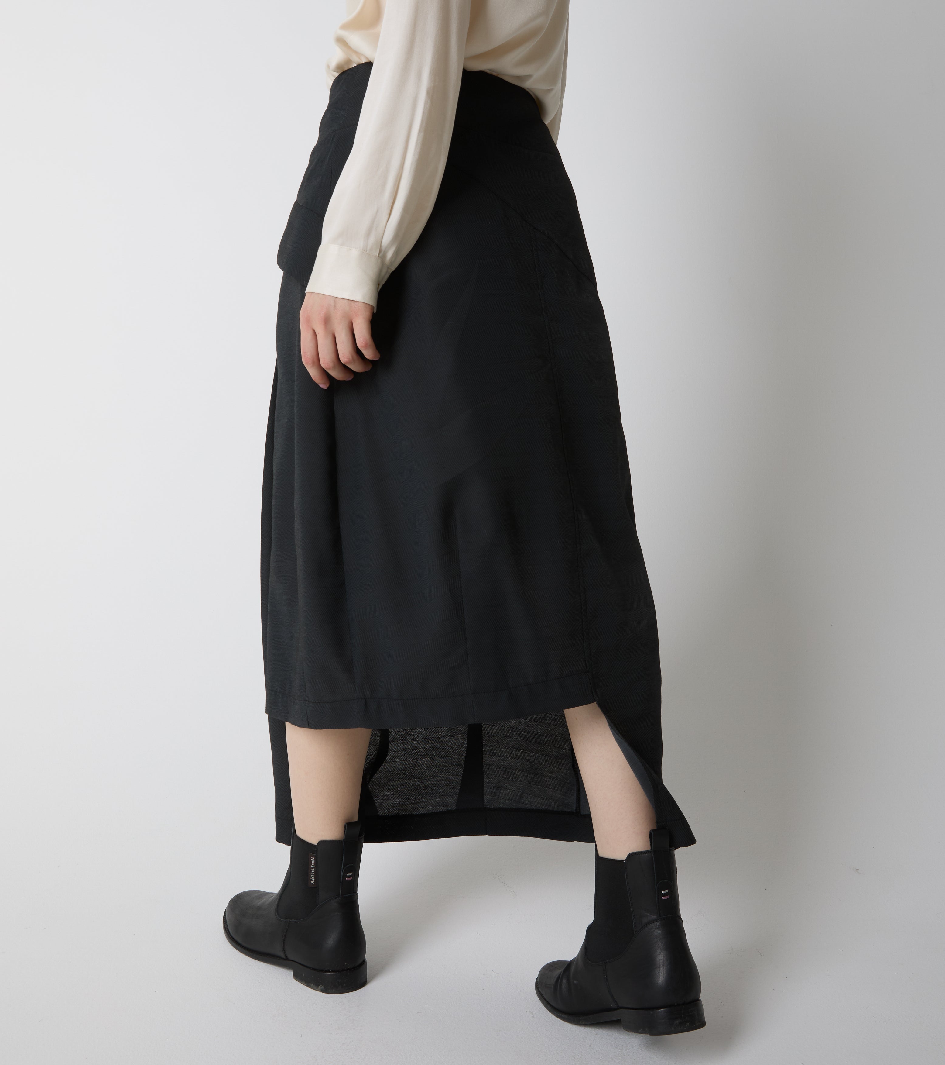 Long asymmetrical skirt with pleats