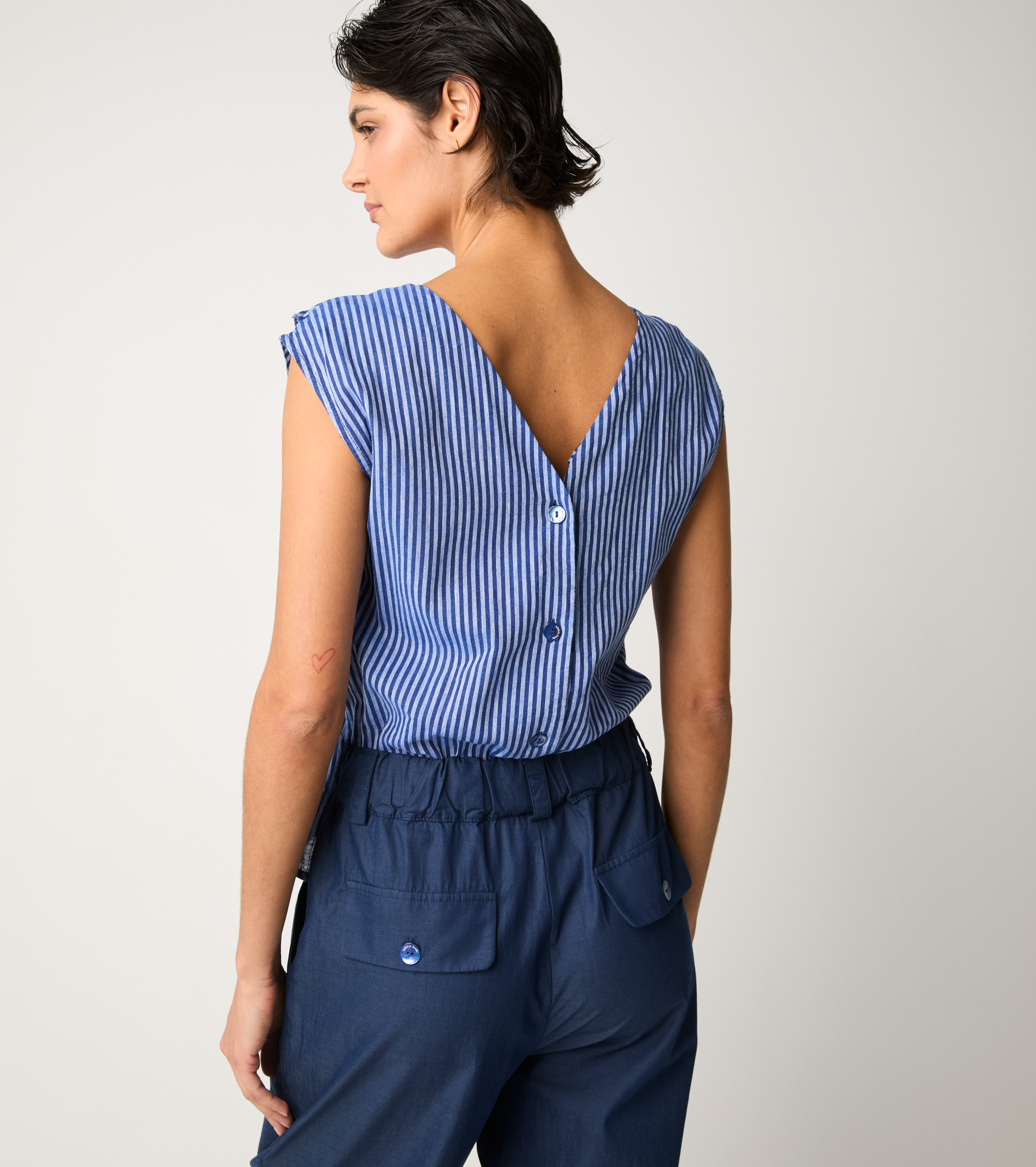 Tuta a righe con rouches azzurro
