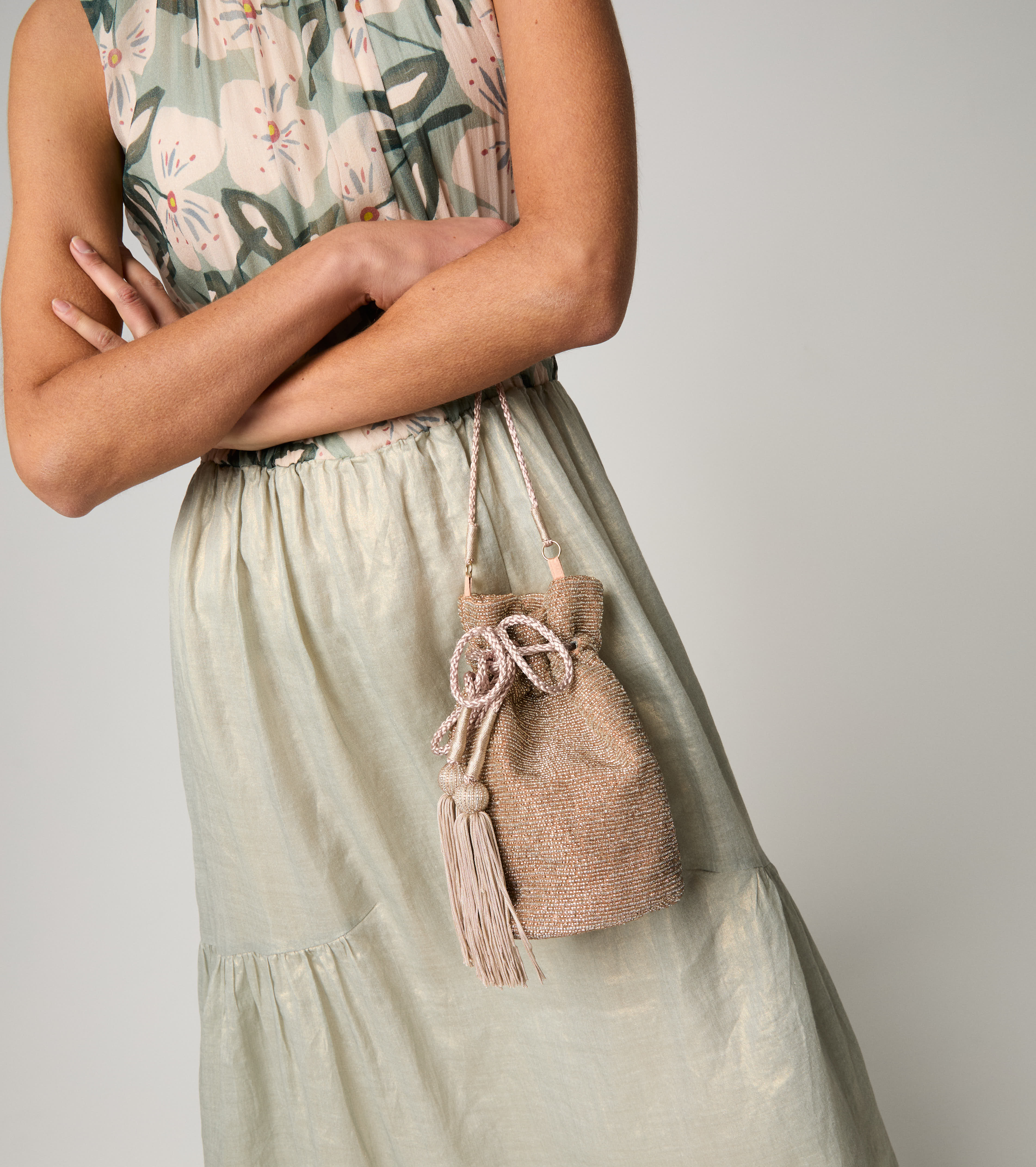 Bucket bag with drawstring and pink tassels