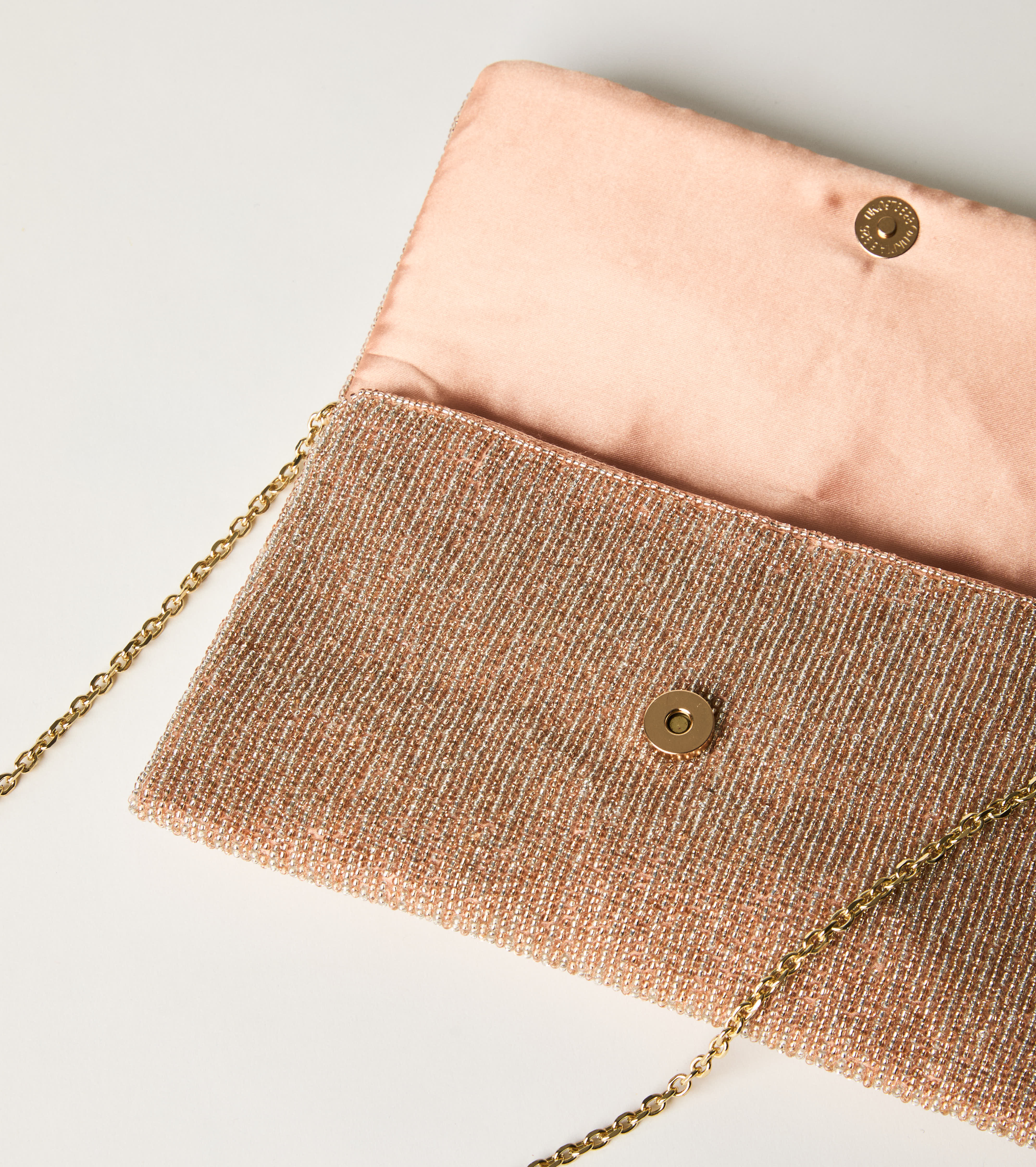 Crossbody bag with chain and pink flap