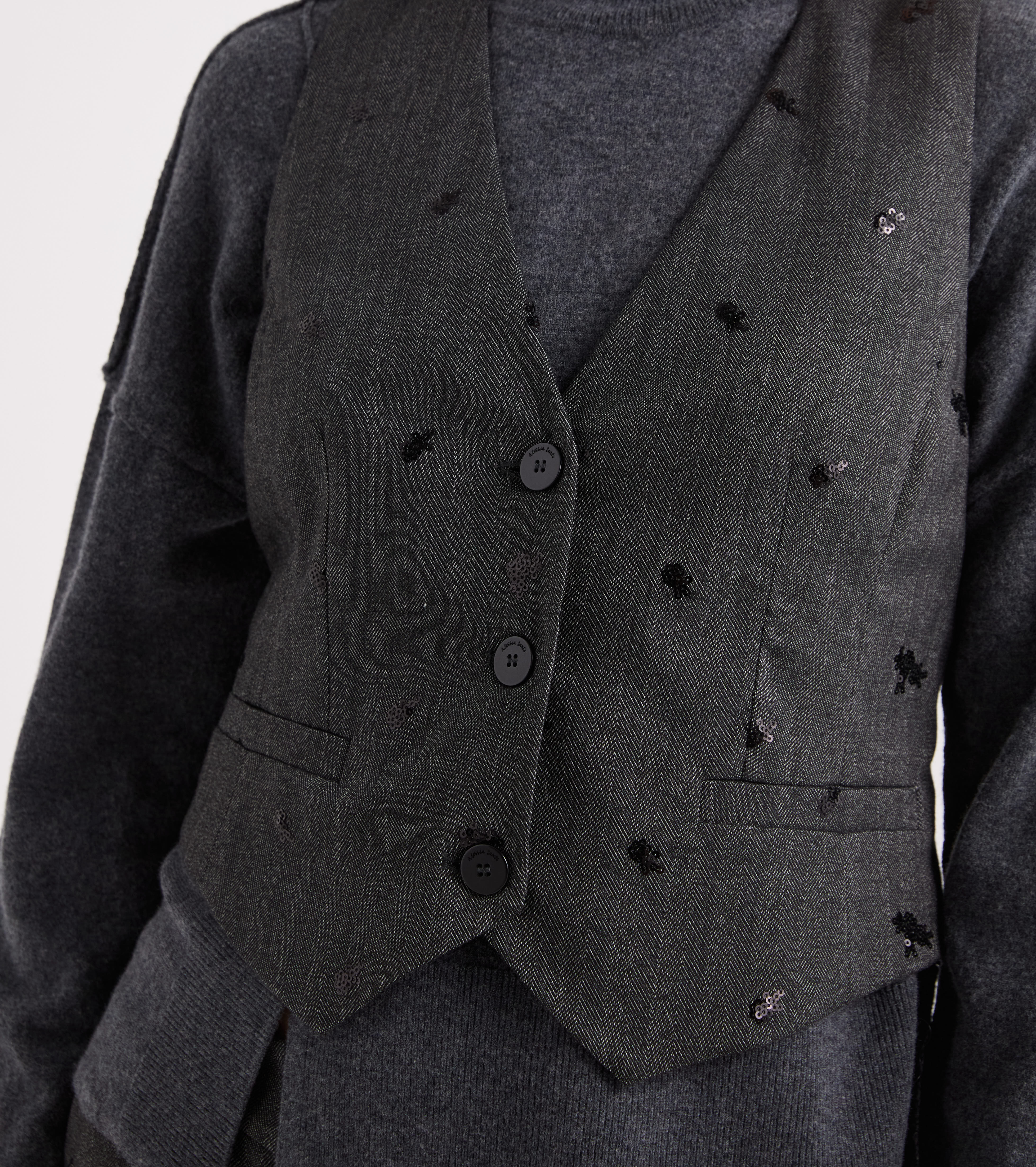 Gilet con scollo a V e ricami nero